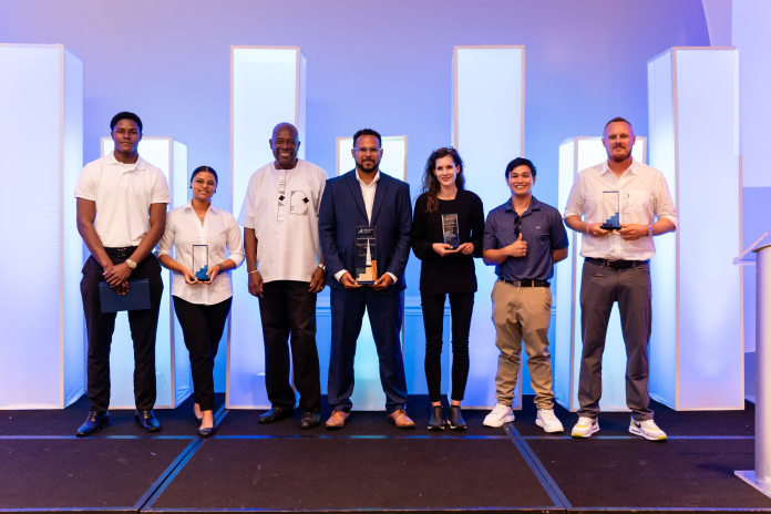 2026 Business Design Competition Award Winners - Shevon Campbell, Carrie Smith, Eustache Placide, Goodman Powery, Natalie Riley, Vincent Ross Lirio and Benjamin Bates (Photo: Enterprise Cayman)