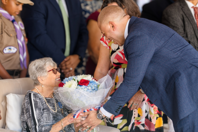 Francine Jackson, who died on 5 July, receiving flowers from Premier André Ebanks (Photo: Cayman Islands Government)