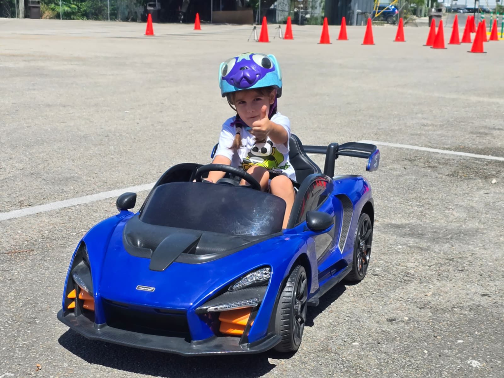 A young spectator tests out the track in a slightly smaller vehicle (Photo: Capataro)